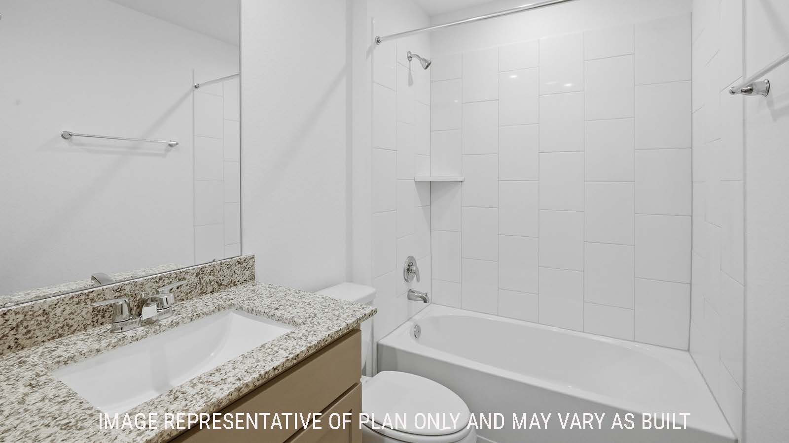 Texas Cali secondary bathroom with vanity sink and shower and tub combo.