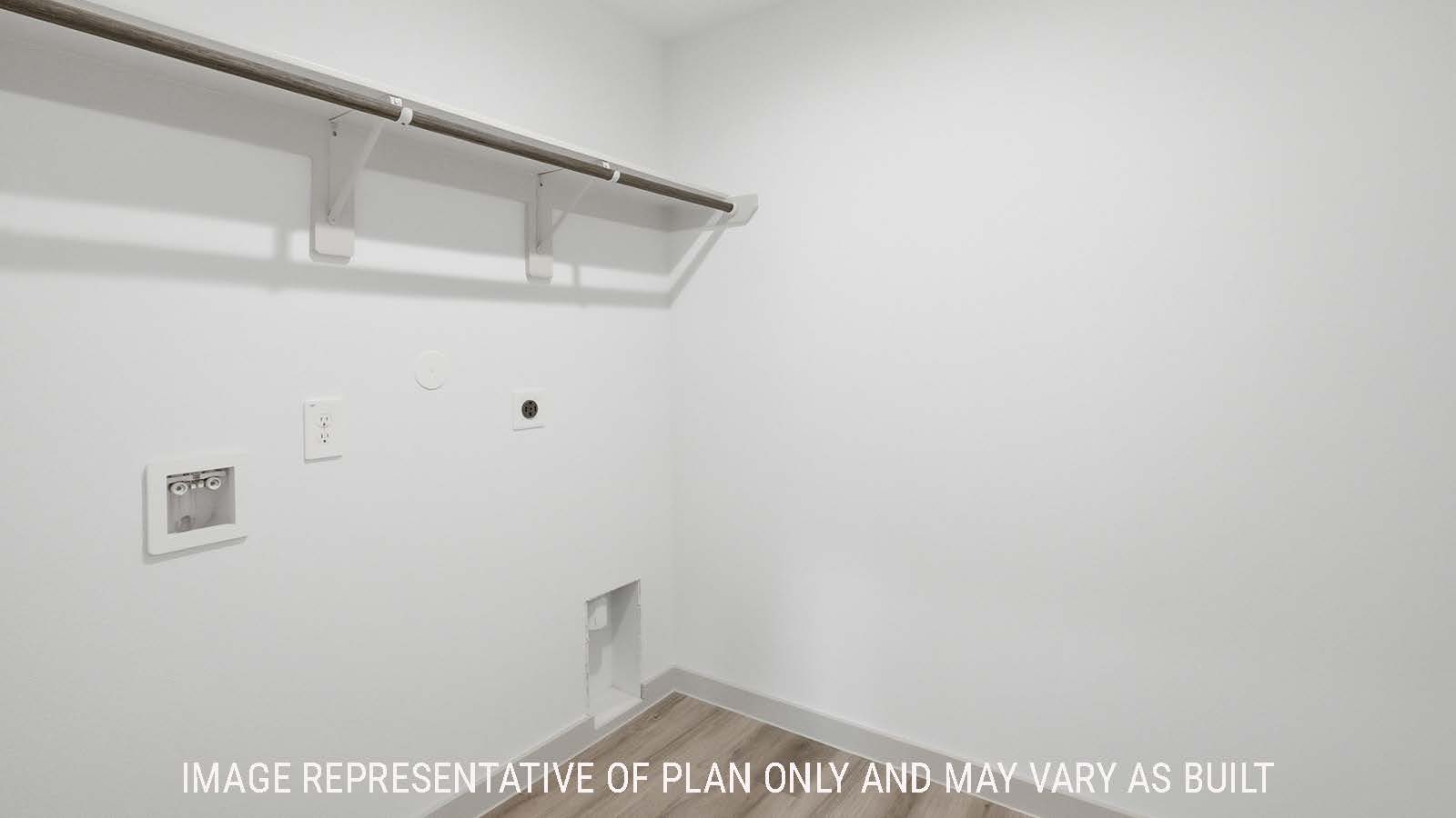 Texas Cali utility room with washer and dryer connections with shelving for storage.