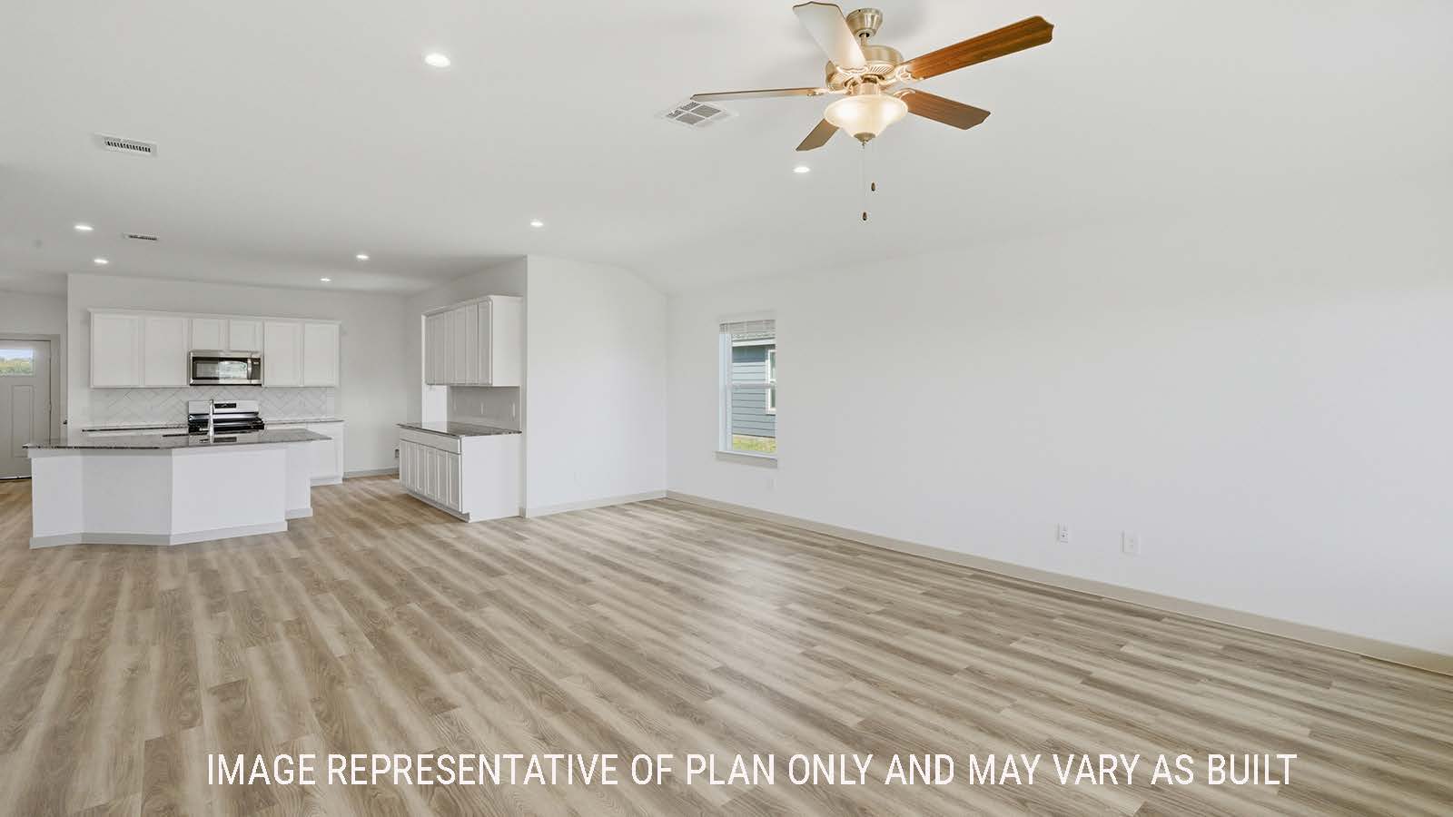 Kingston living room with vinyl plank flooring with view of open concept dining room and kitchen.