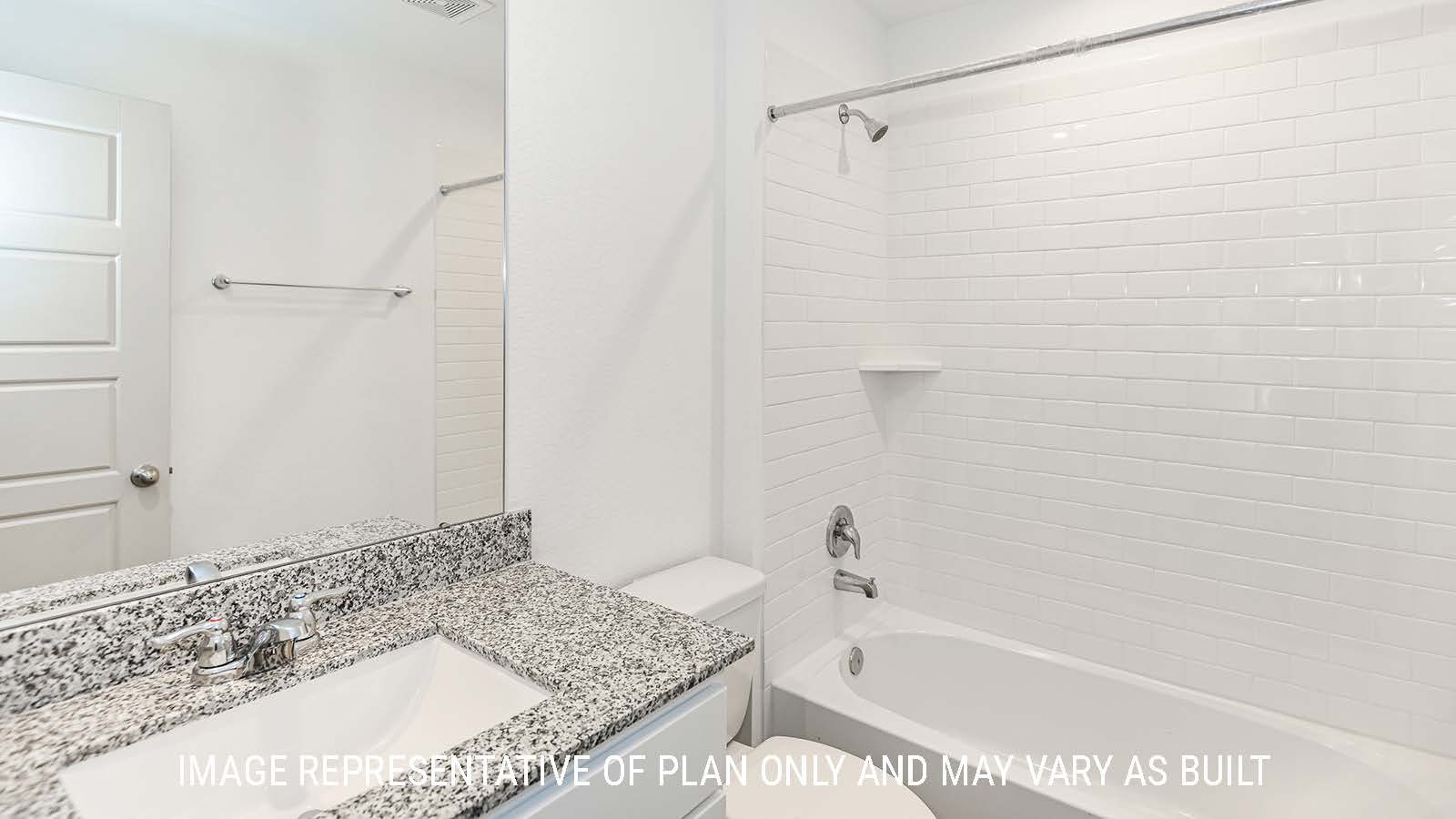 Lakeway secondary bathroom with vanity sink and shower and tub combo.