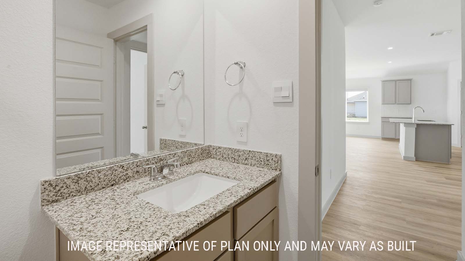 Lakeway secondary bathroom with vanity sink with view of open concept kitchen.