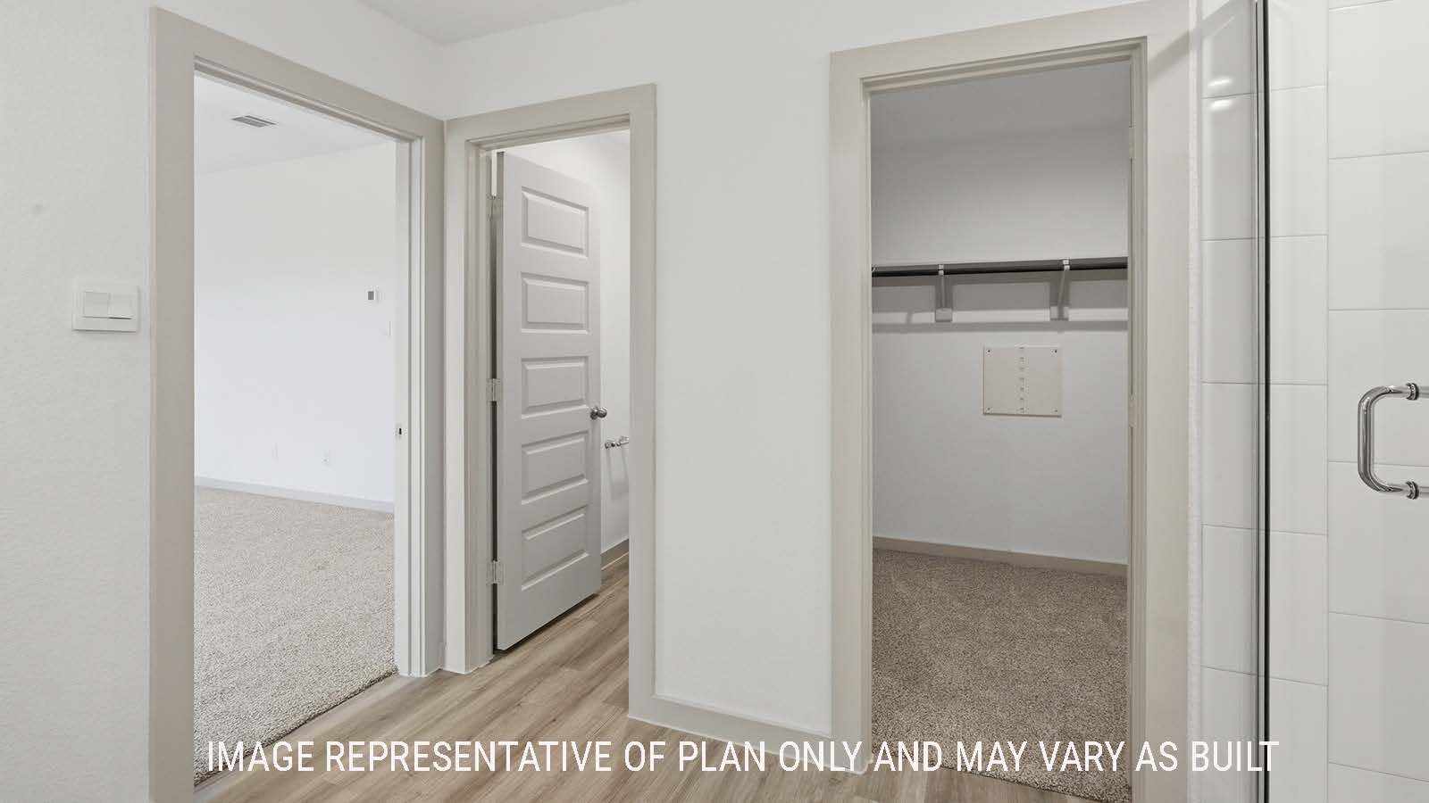 Lakeway primary bathroom with view of primary bedroom and primary bedroom walk-in closet.