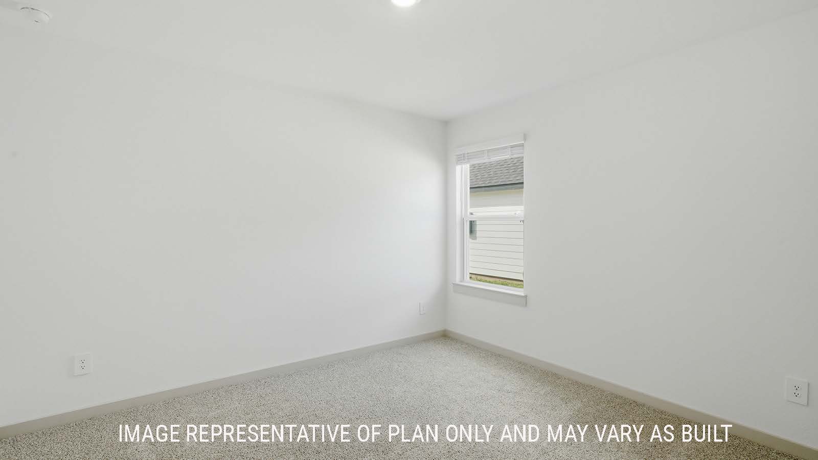 Lakeway secondary bedroom with carpeted flooring and window for natural lighting.