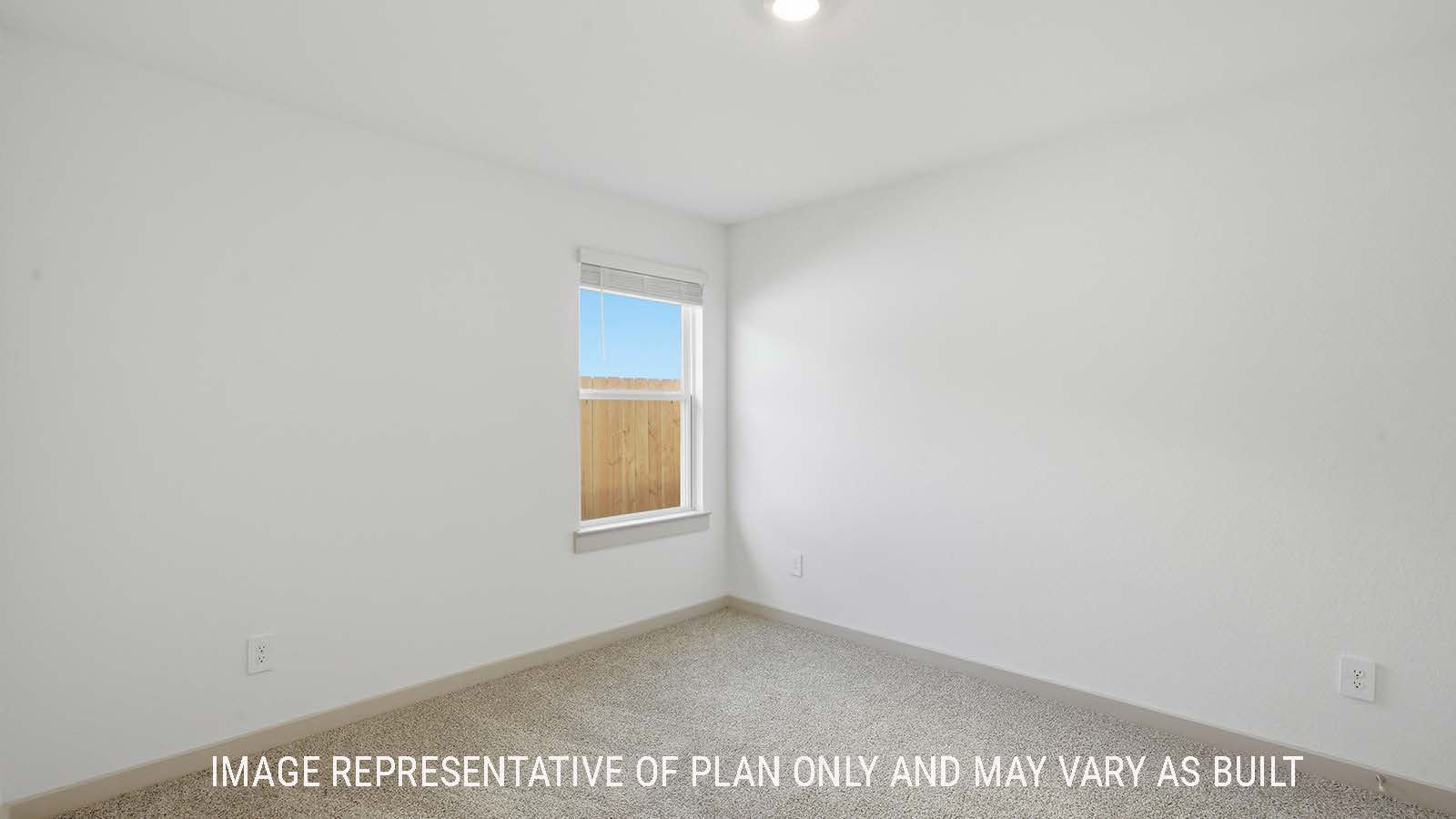 Lakeway secondary bedroom with carpeted flooring and window for natural lighting.