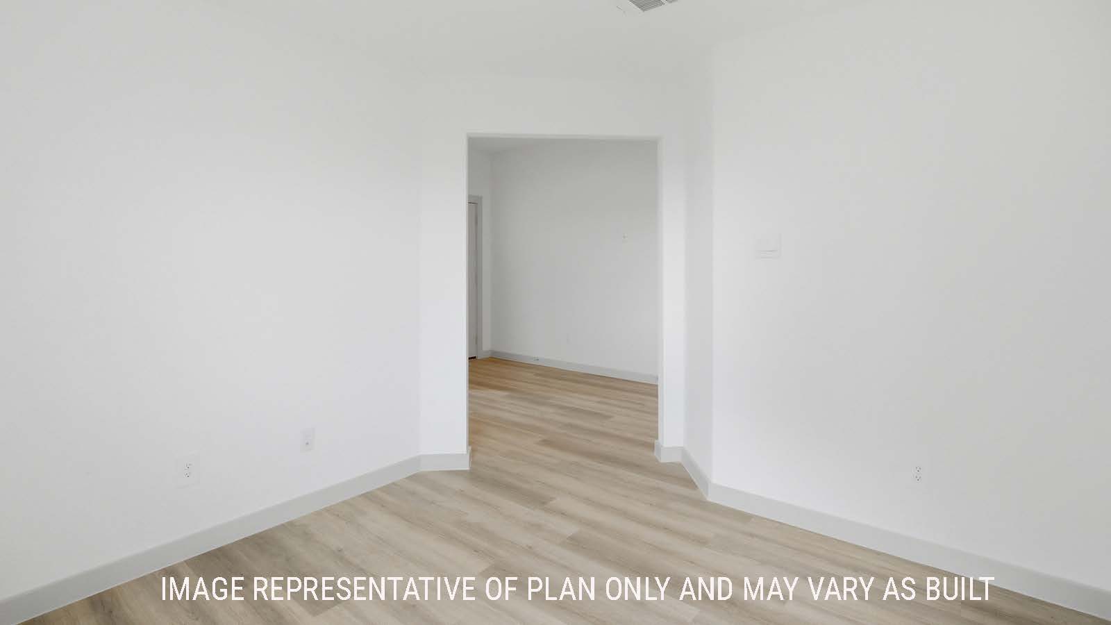 Lakeway study with vinyl plank flooring and view of front entry hallway.