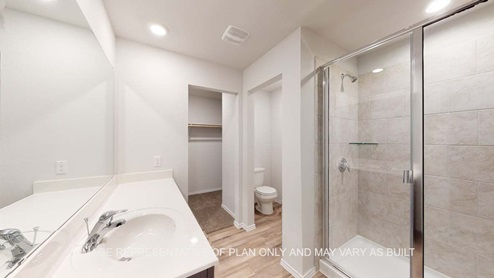 Ashburn primary bathroom with clear shower glass enclosure with ceramic tile shower surround.Ashburn primary bathroom with clear shower glass enclosure with ceramic tile shower surround.