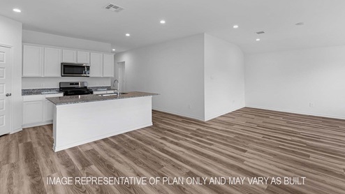 Denton kitchen island with granite countertops and view of dining room.