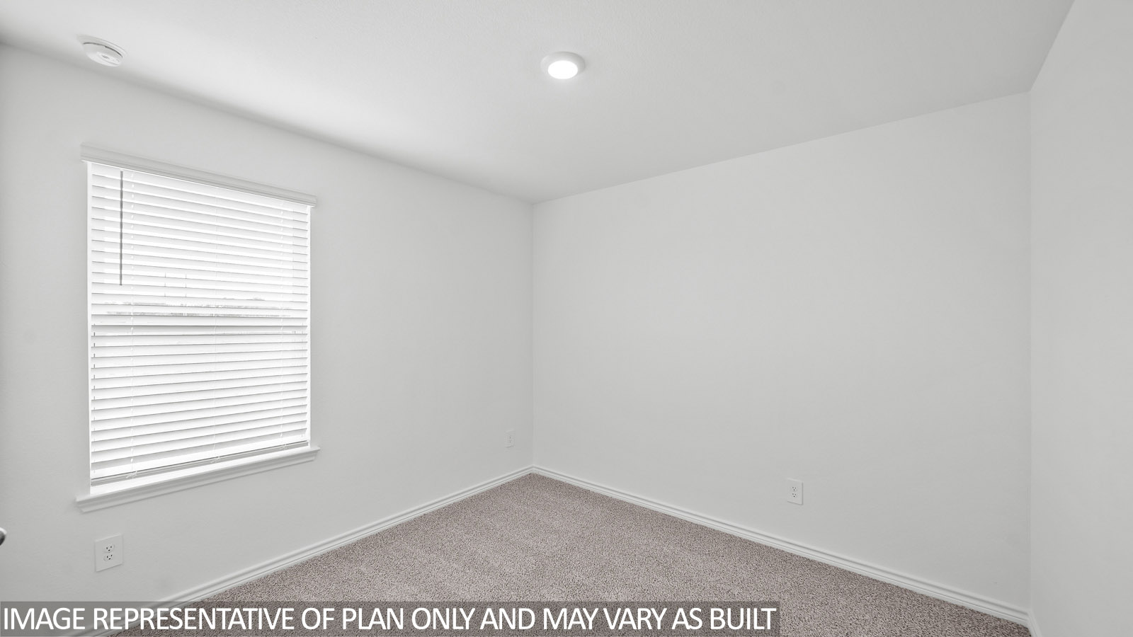 Harris secondary bedroom with carpet and window.