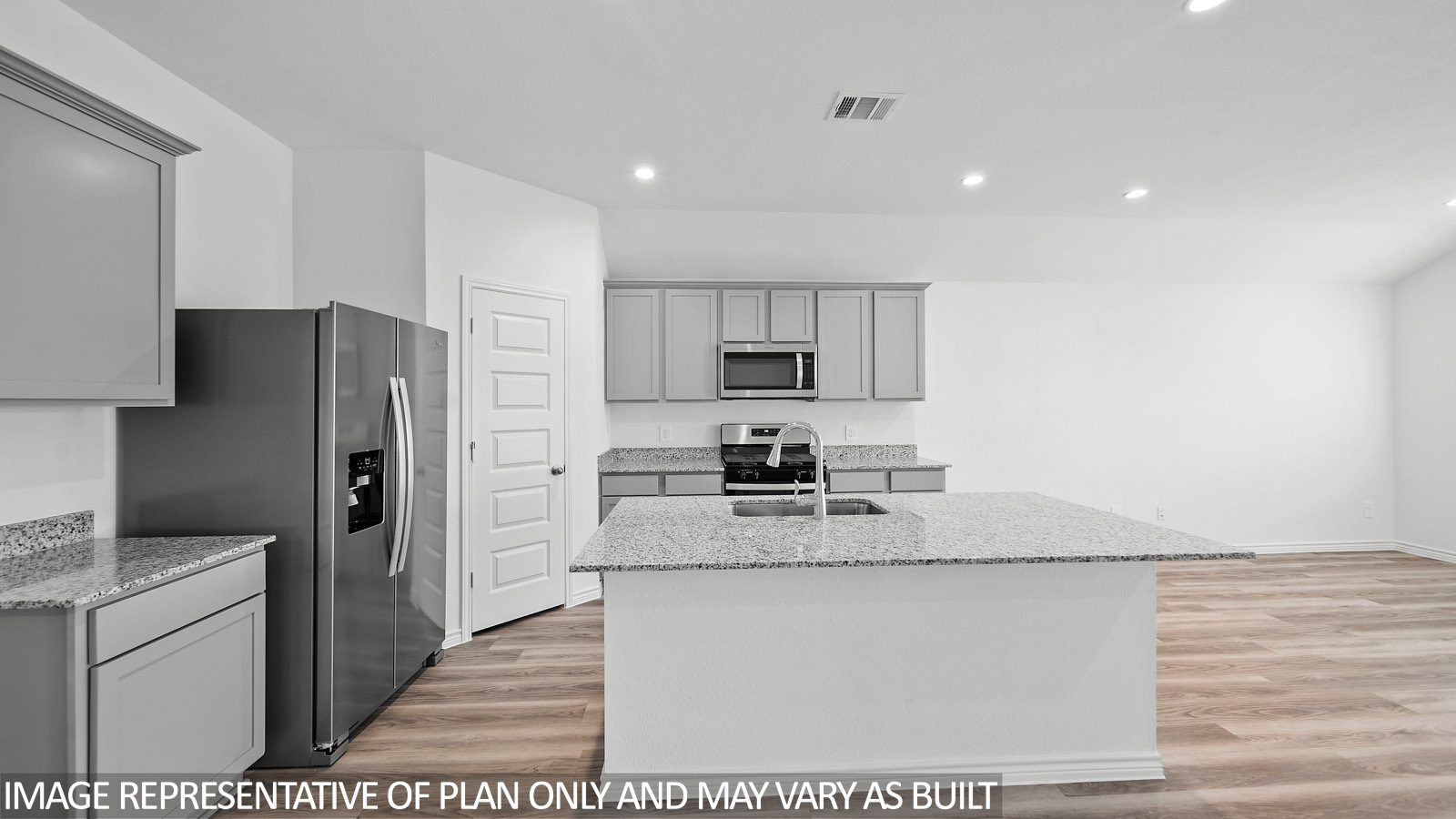 Harris kitchen with spacious island and gray cabinets, granite countertops and vinyl plank flooring.