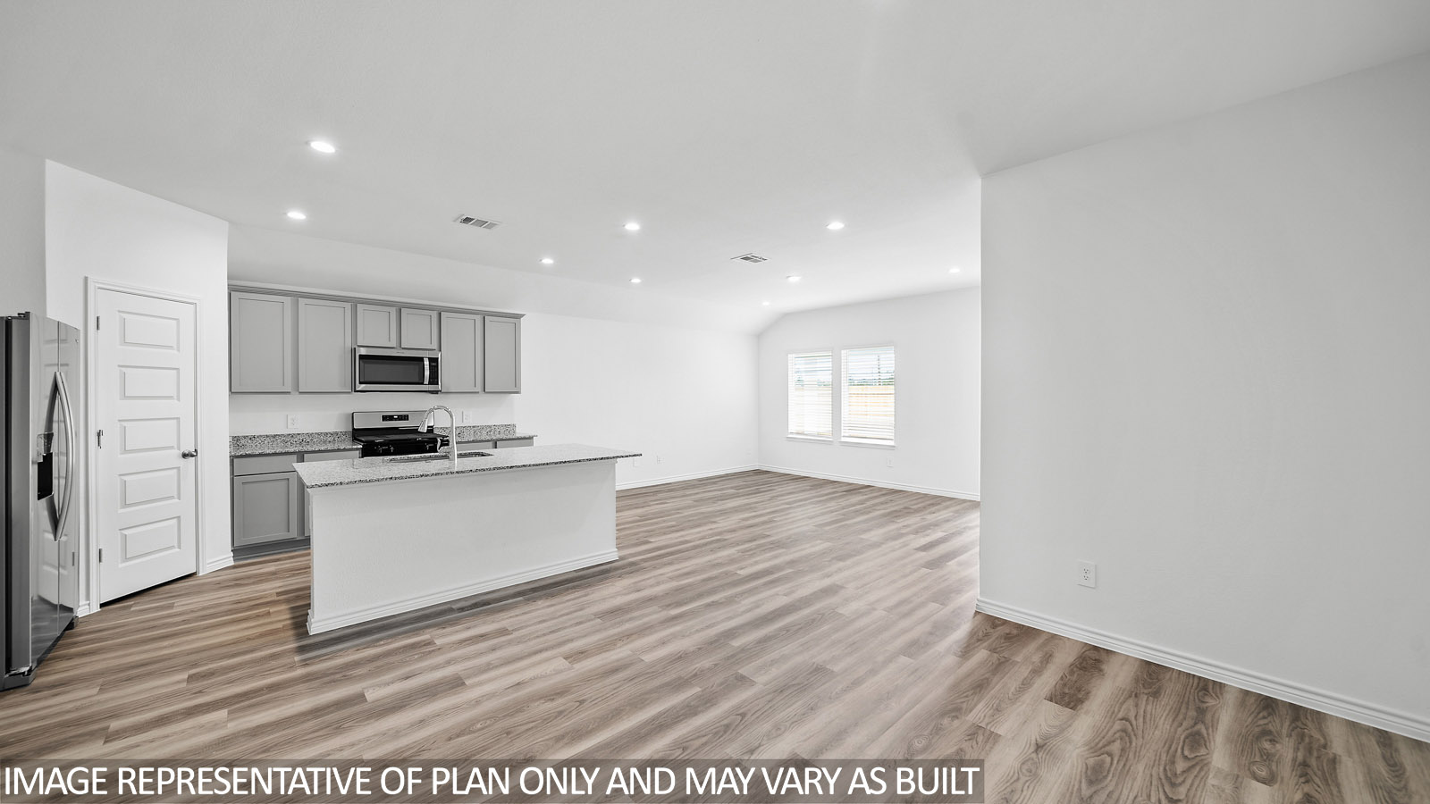 Harris kitchen with spacious island and gray cabinets, granite countertops and vinyl plank flooring.