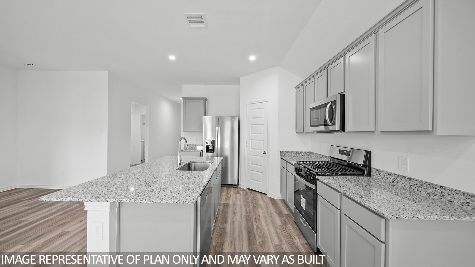Harris kitchen with spacious island and gray cabinets, granite countertops and vinyl plank flooring.