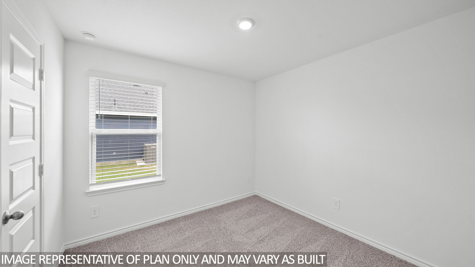 Harris secondary bedroom with carpet and window.