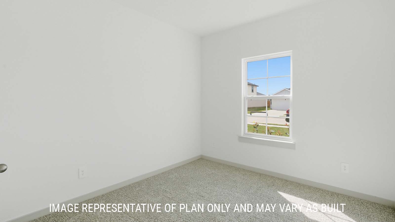 Mitchell secondary bedroom with carpeted flooring and window for natural lighting.