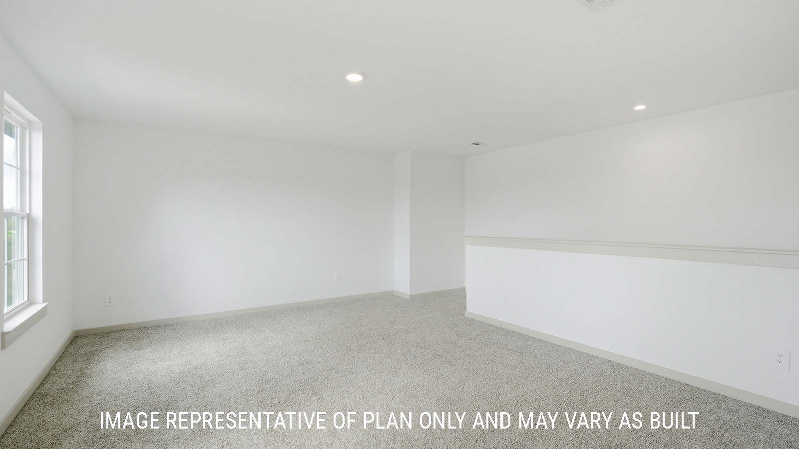 Mitchell game room with carpeted flooring and windows for natural lighting.