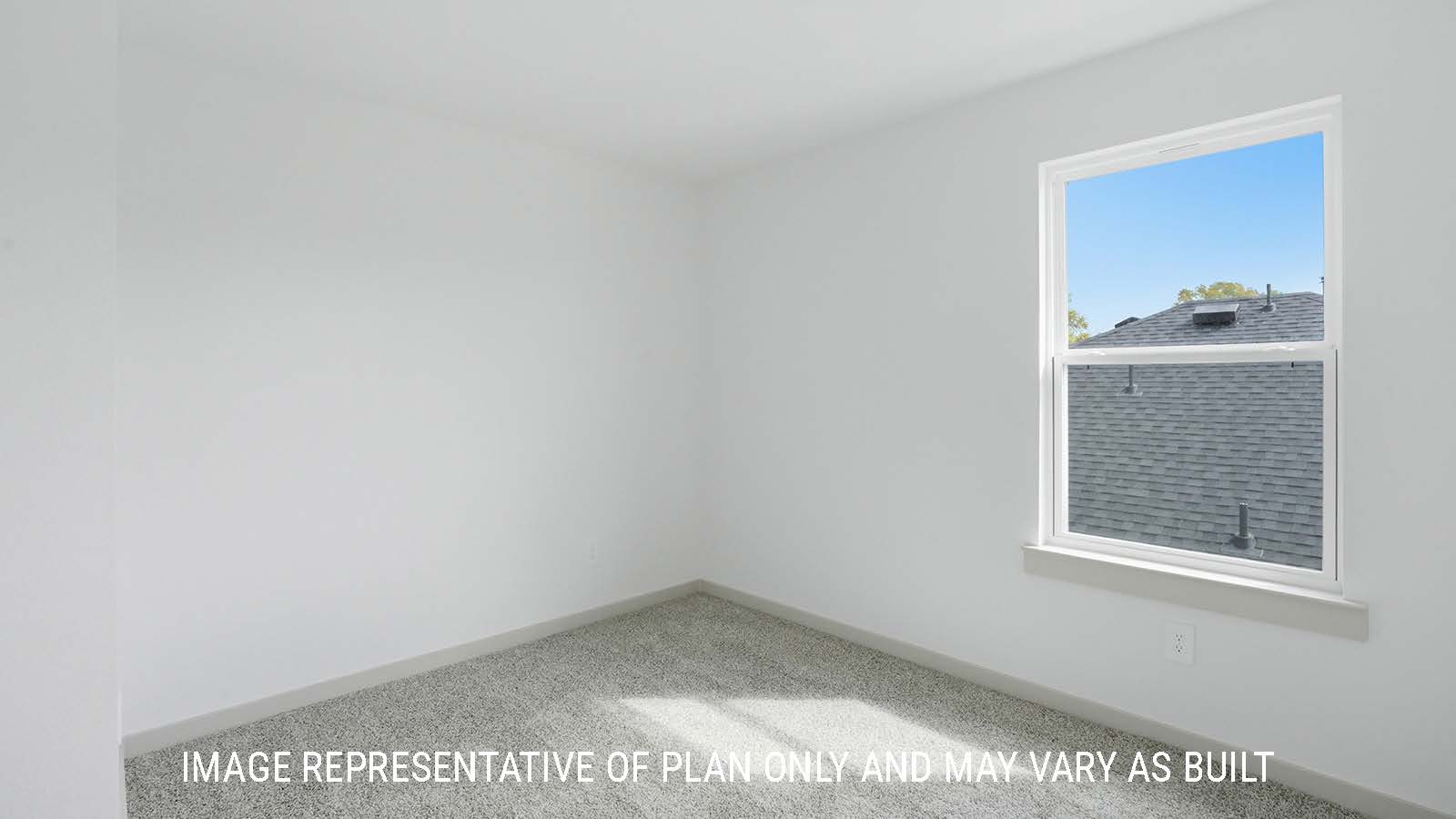 Mitchell secondary bedroom with carpeted flooring and window for natural lighting.