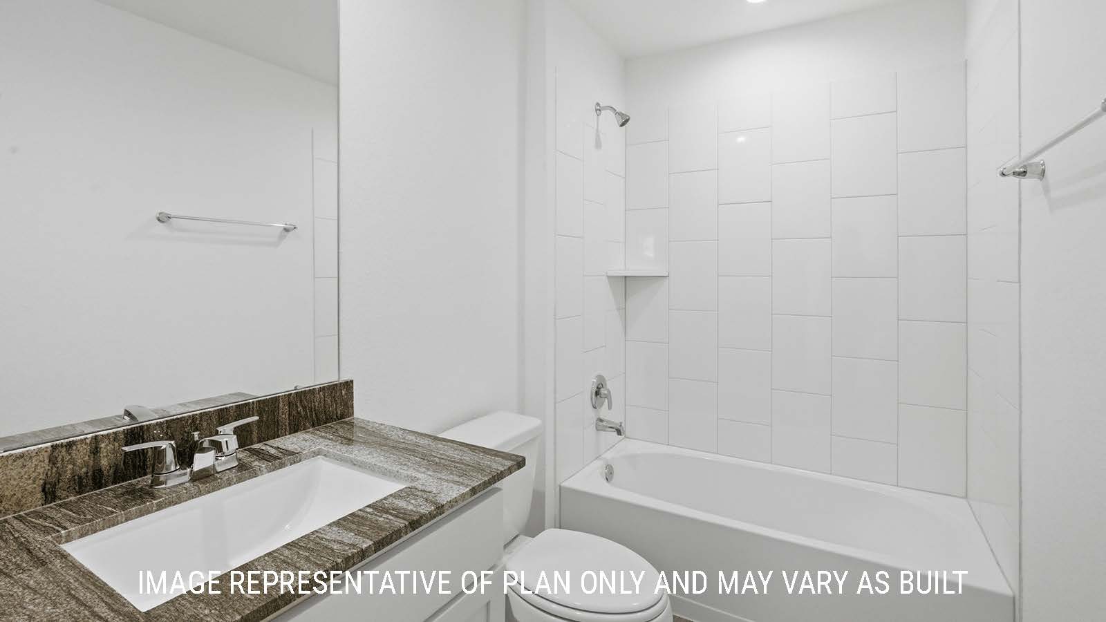 Mitchell secondary bathroom with vanity sink and shower and tub combo.