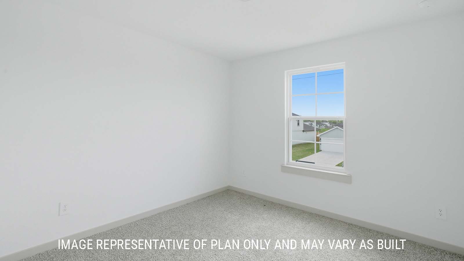 Mitchell secondary bedroom with carpeted flooring and window for natural lighting.