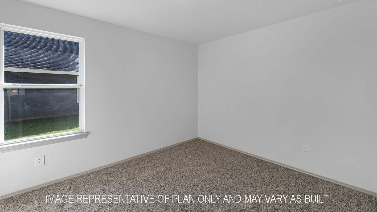 Bellvue secondary bedroom with carpet flooring and window.