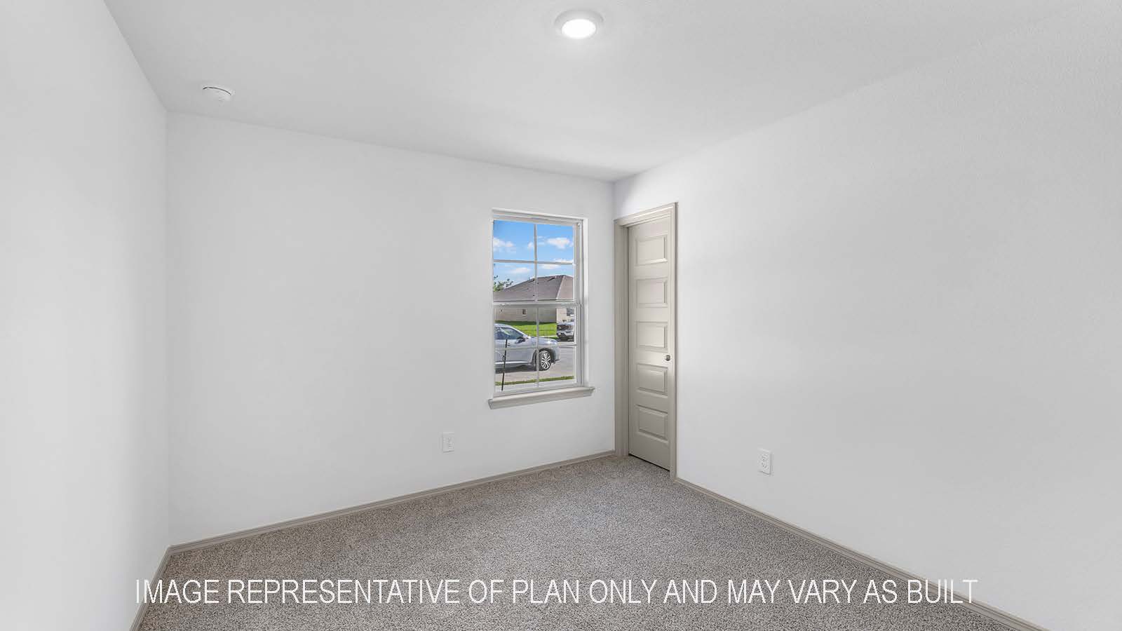 Bellvue secondary bedroom with carpet flooring and window.