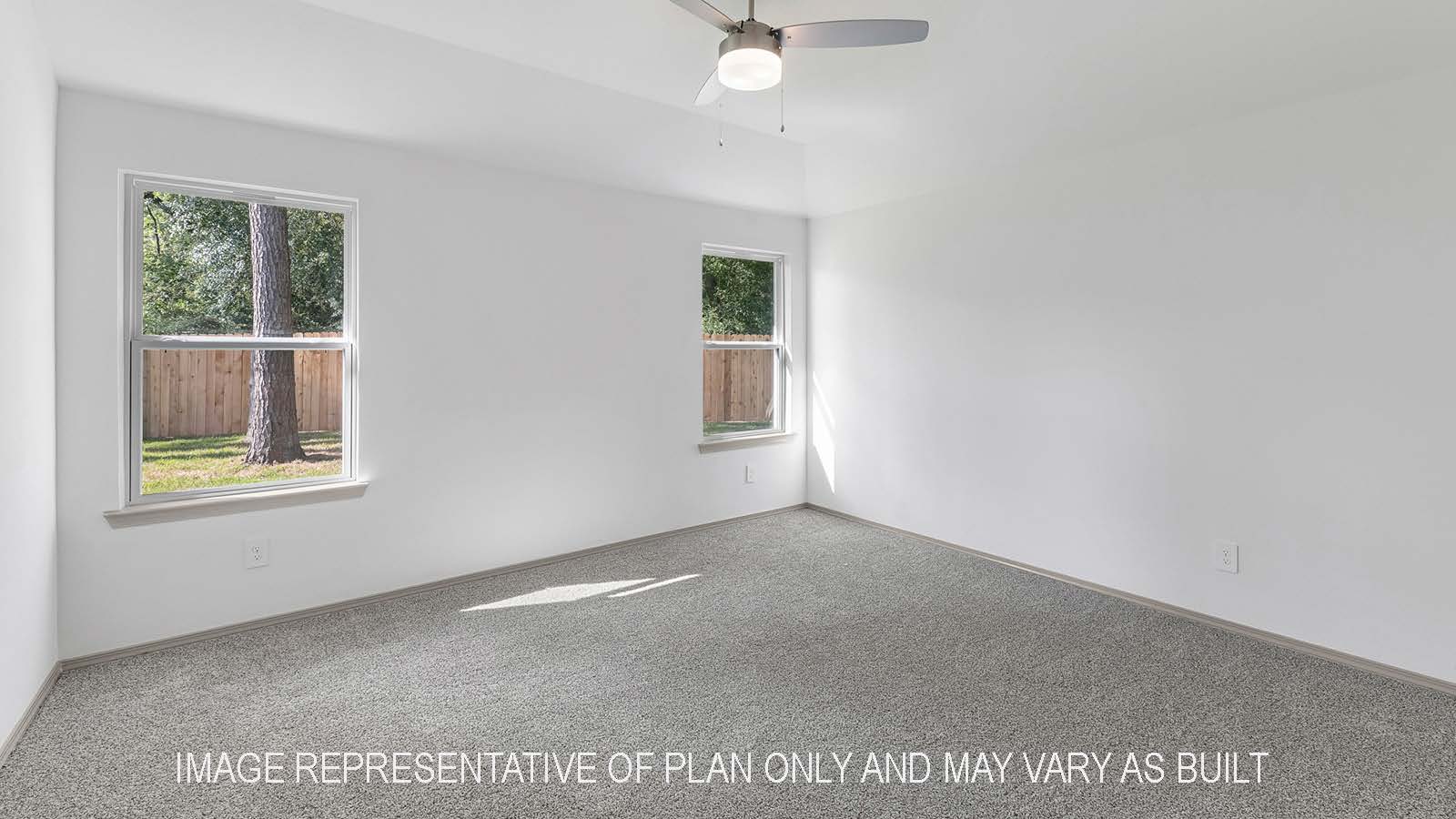 Bellvue primary bedroom with windows and carpet flooring.