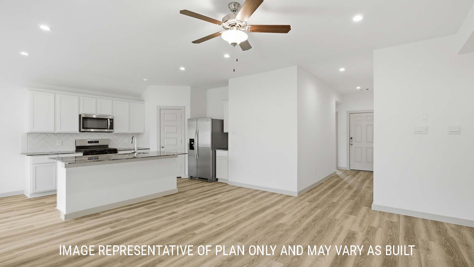 Bellvue living room with vinyl plank flooring and view of open concept kitchen and front entry way.