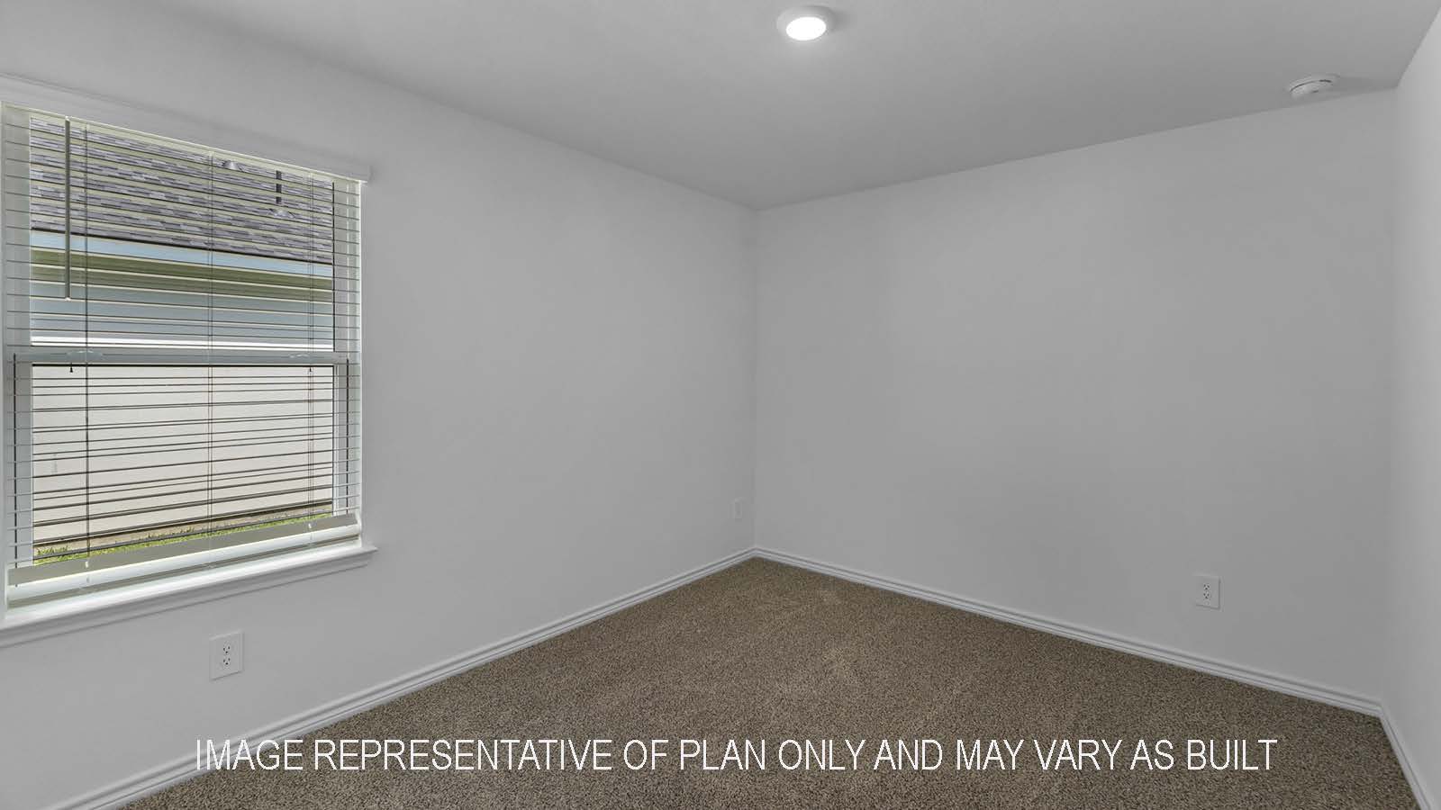 Denton secondary bedroom with carpet flooring and windows.