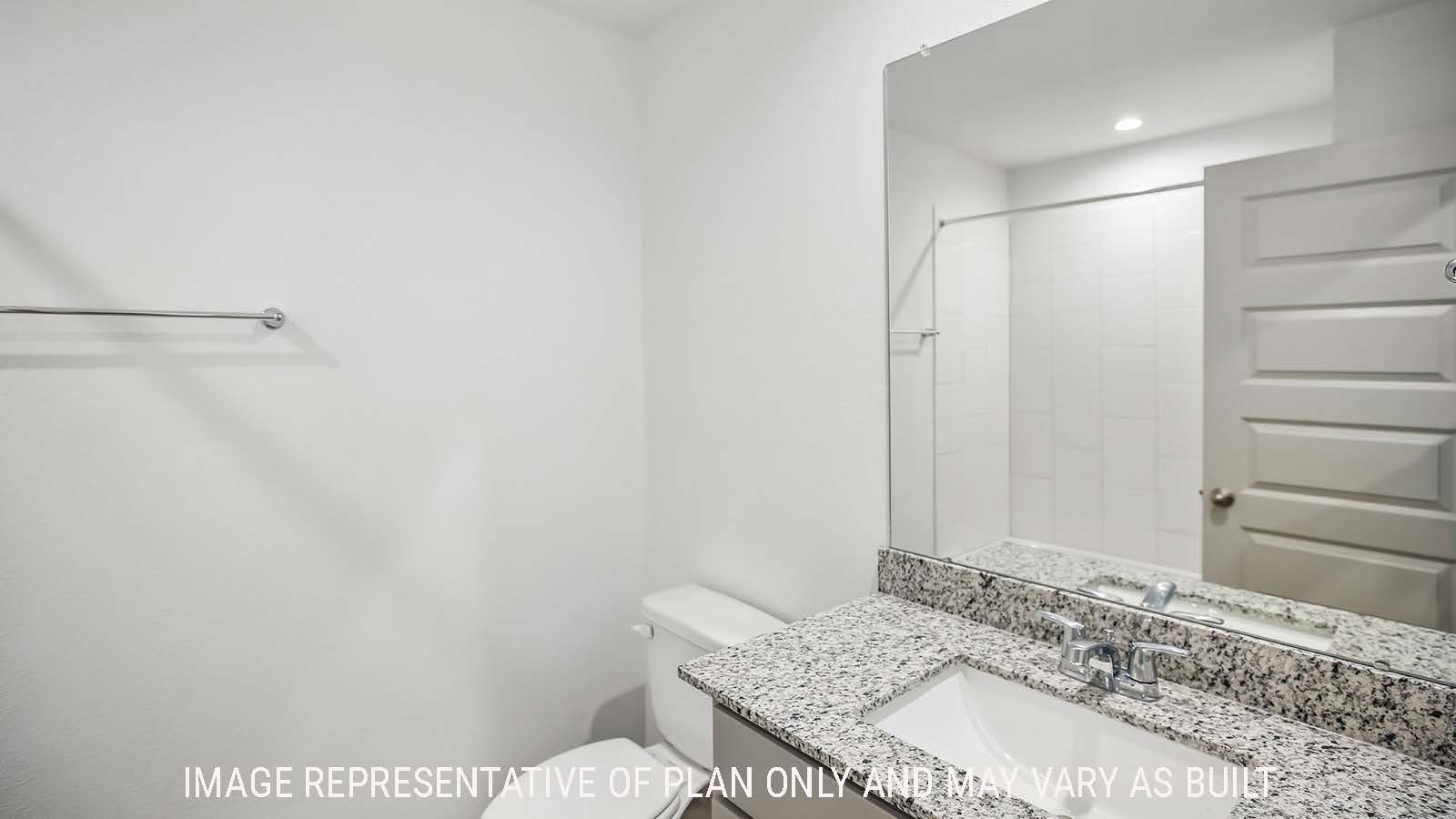 Denton secondary bathroom with vanity sink with granite countertops and mirror.