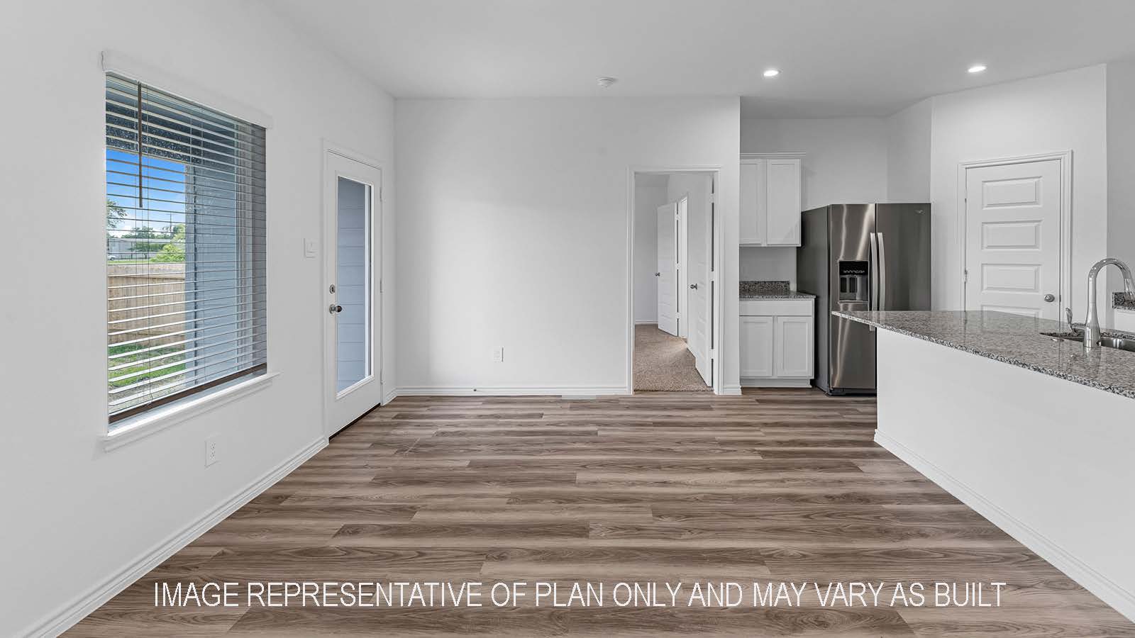 Denton dining room open concept with view of backyard.