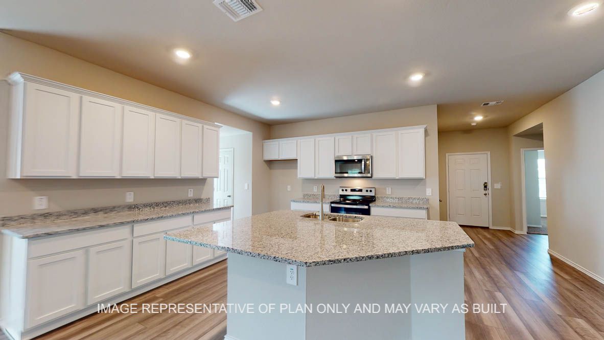 Kingston kitchen with kitchen island with granite countertops and view of open concept dining room and living room.