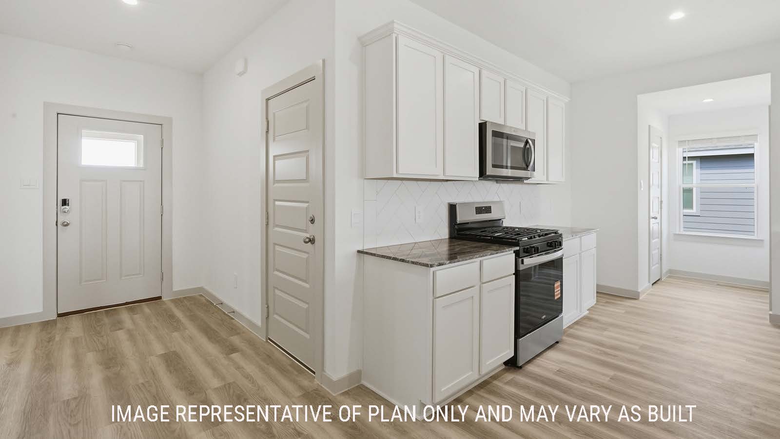 Kingston entry hallway with vinyl plank flooring and view of open concept kitchen.