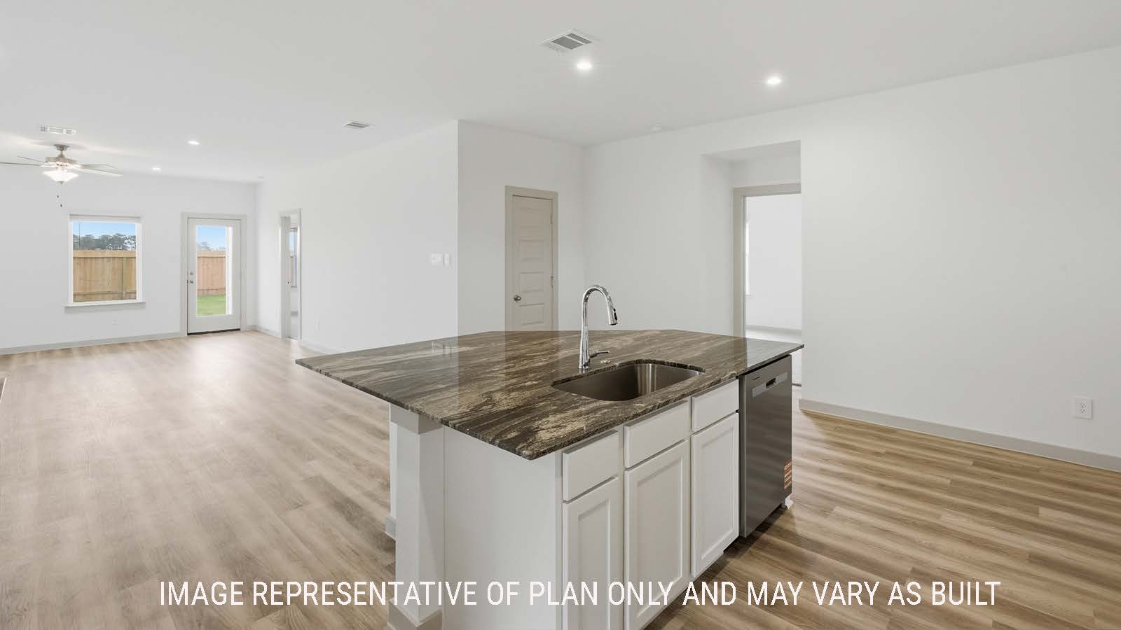 Kingston kitchen with kitchen island with granite countertops and view of open concept dining room and living room.
