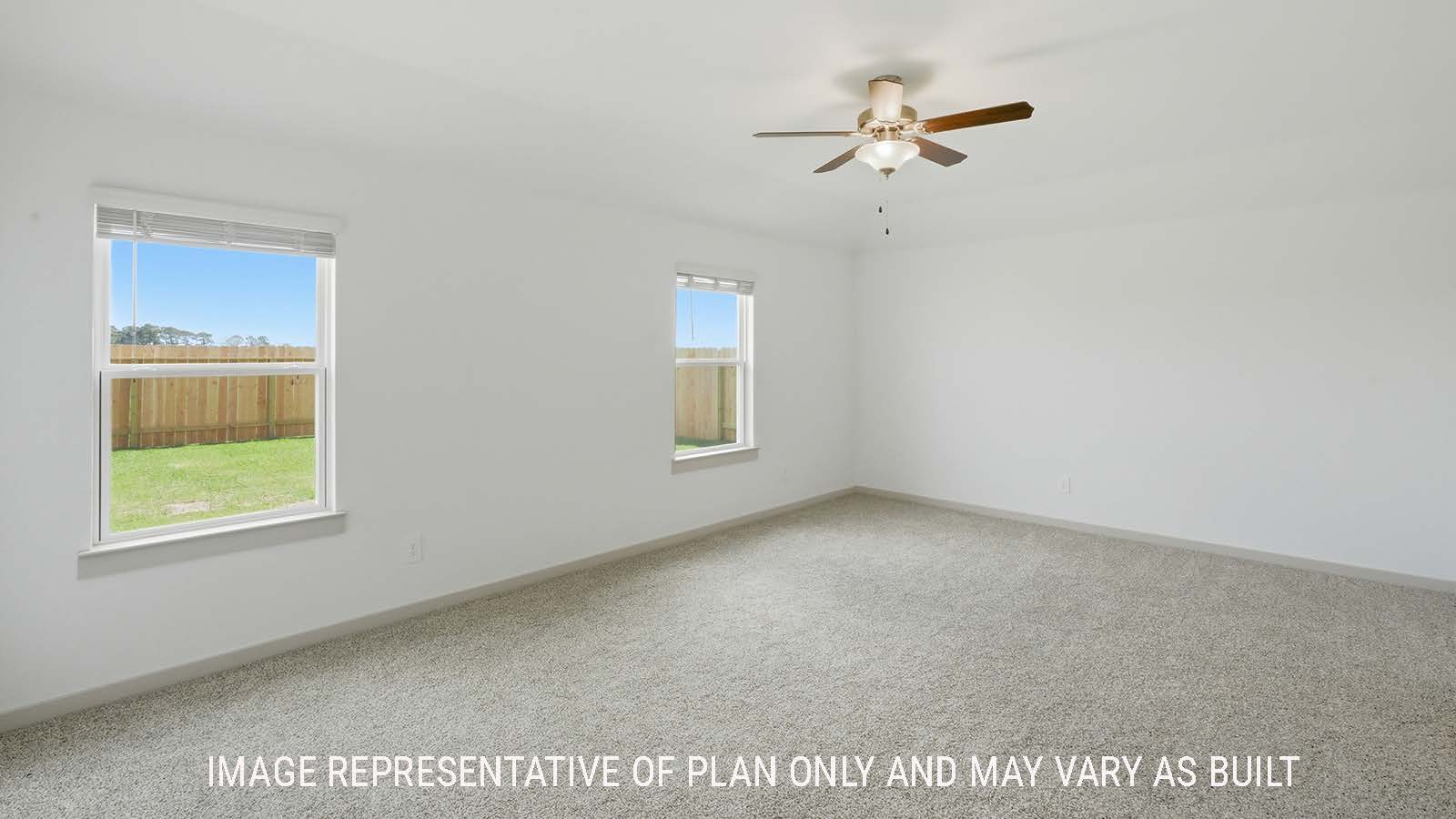 Kingston primary bedroom with carpeted flooring and windows for natural lighting.