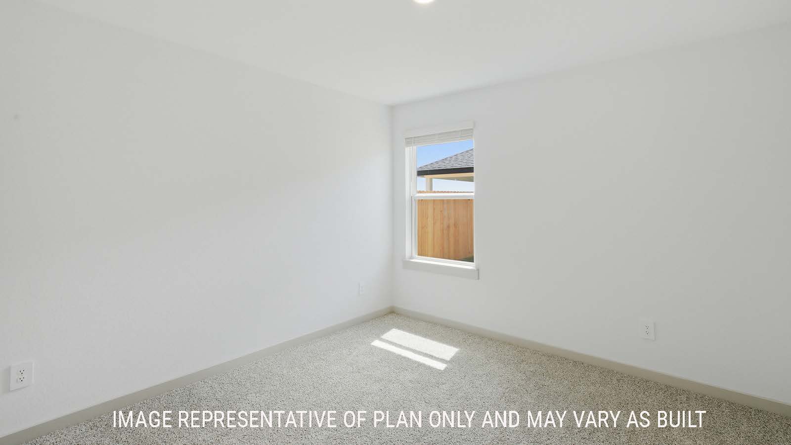 Kingston secondary bedroom with carpeted flooring and window for natural lighting.