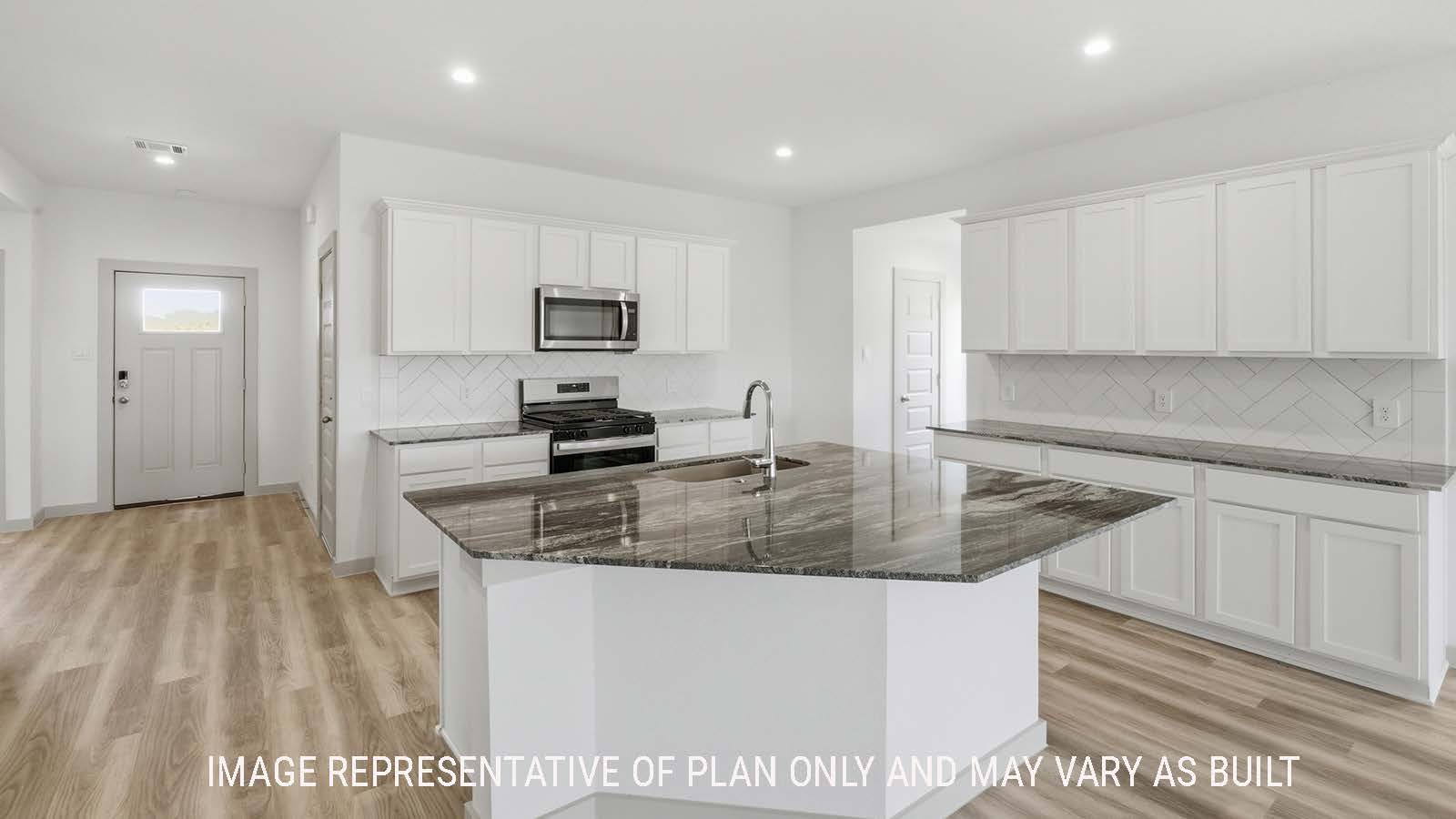 Kingston kitchen with kitchen island with granite countertop with view of front entry hallway.