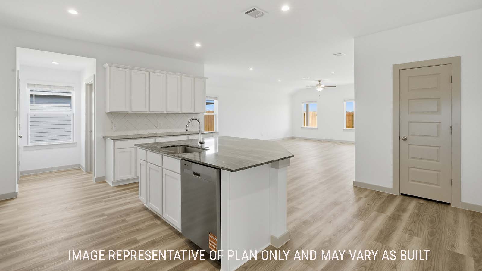 Kingston kitchen with kitchen island with granite countertops and view of open concept dining room and living room.