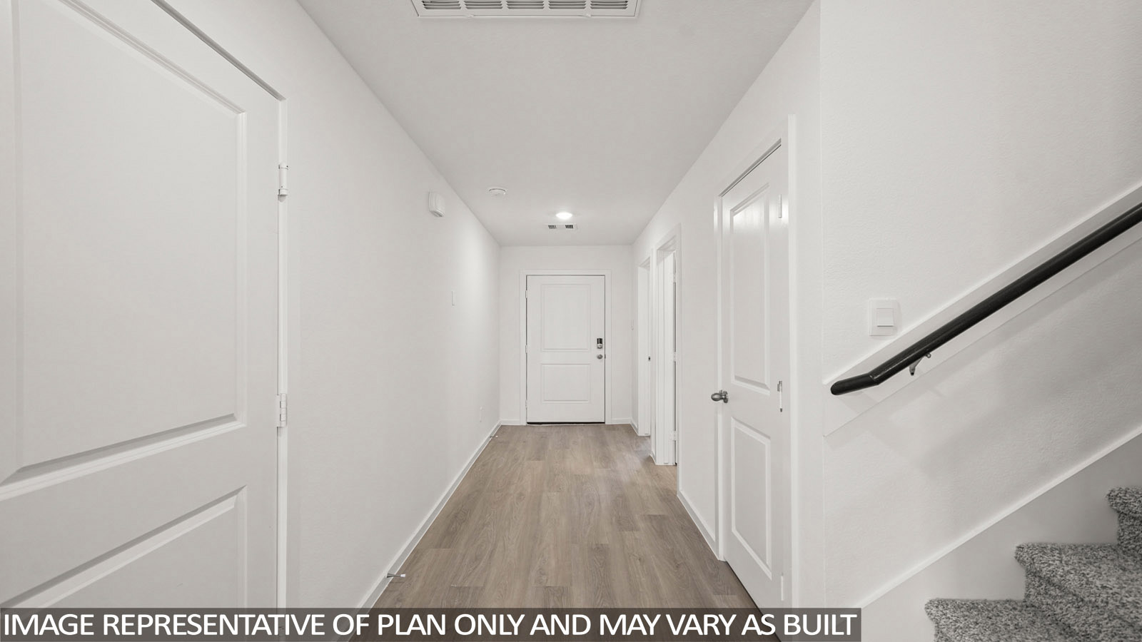 Dawson front hallway with vinyl plank flooring and view of front entry.