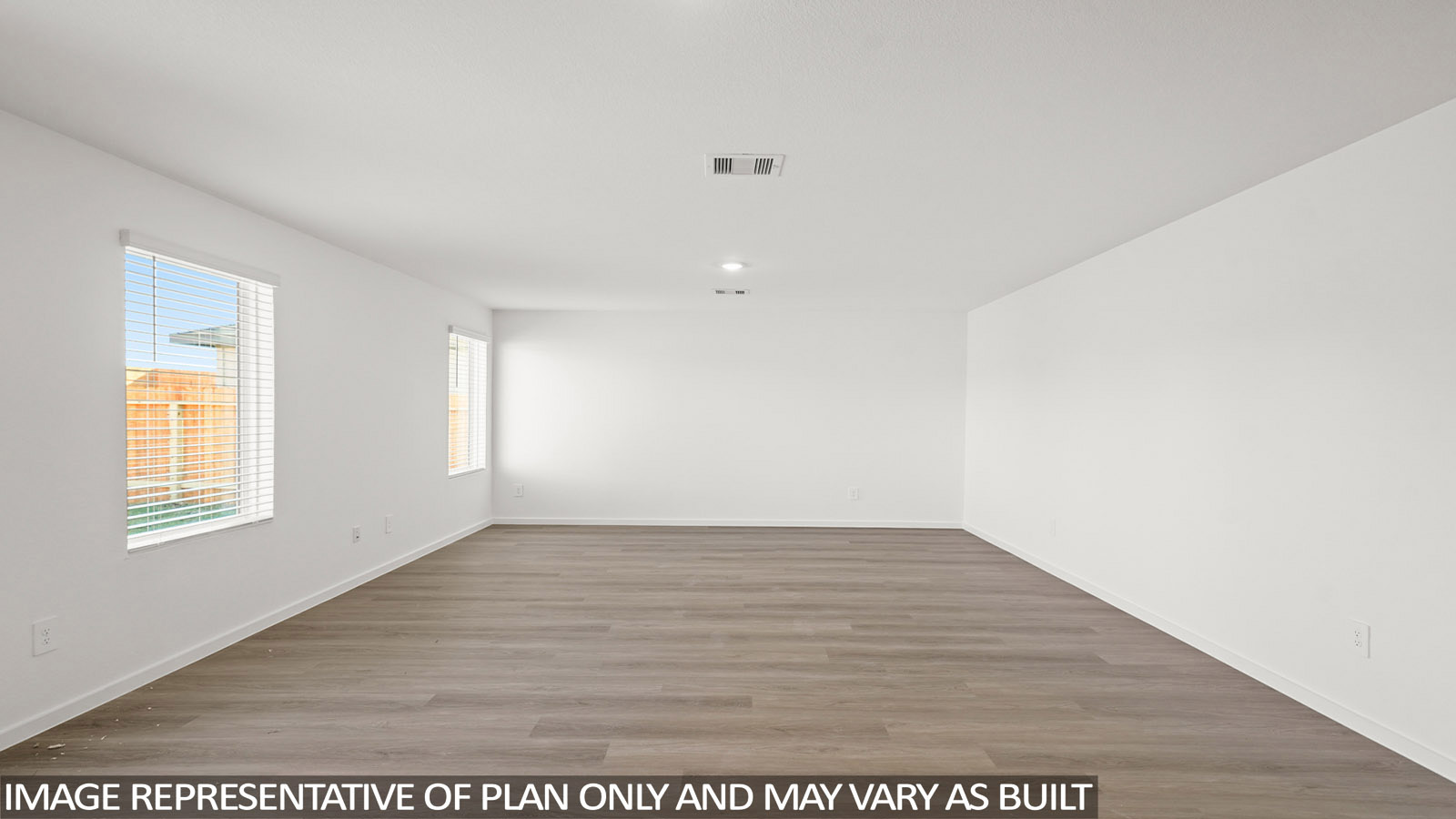 Dawson living room with vinyl plank flooring with view of back door and back yard.