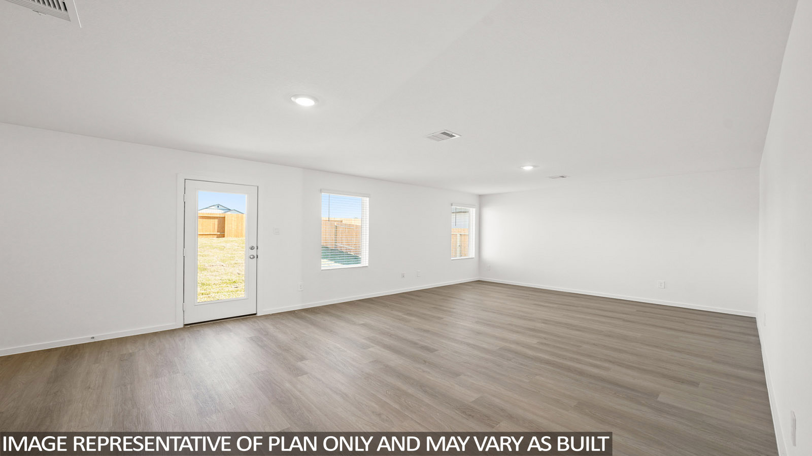 Dawson living room with vinyl plank flooring with view of back door and back yard.