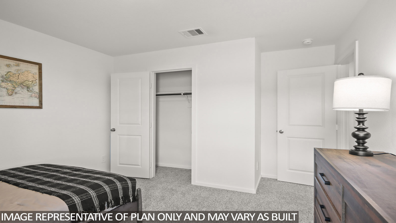 Austin secondary bedroom with carpeted flooring and view of closet.
