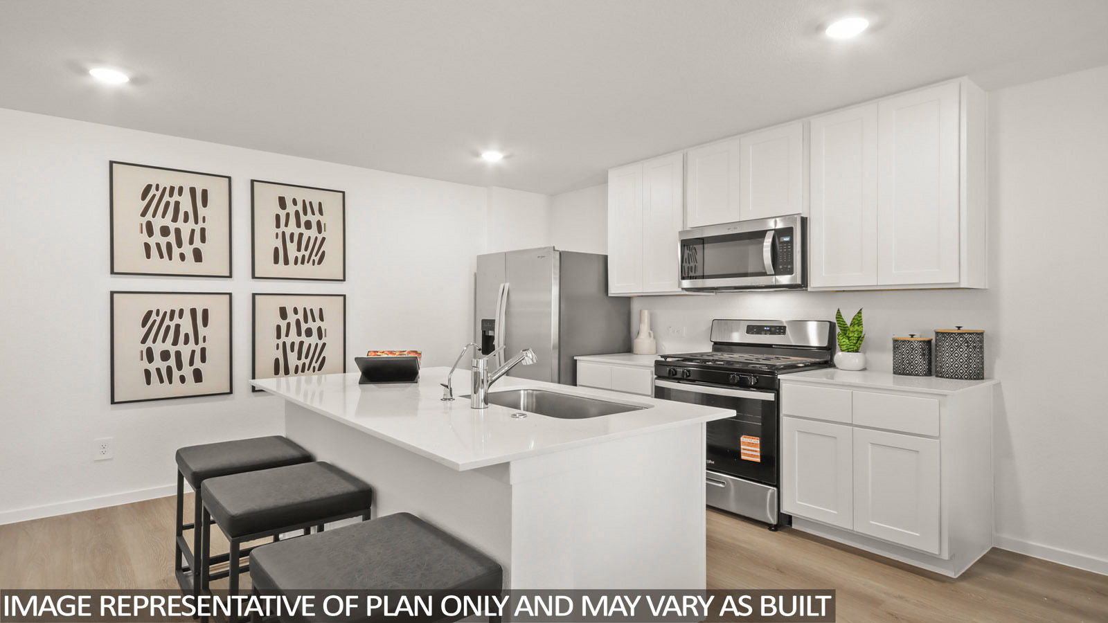 Austin kitchen with kitchen island and white cabinets and light countertops.