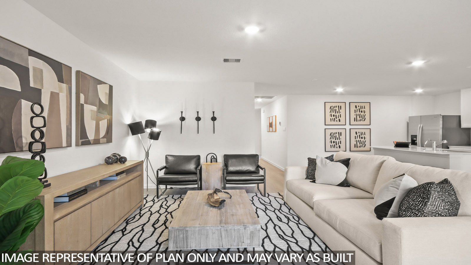 Austin living room  with view of open-concept kitchen and front entry hallway.