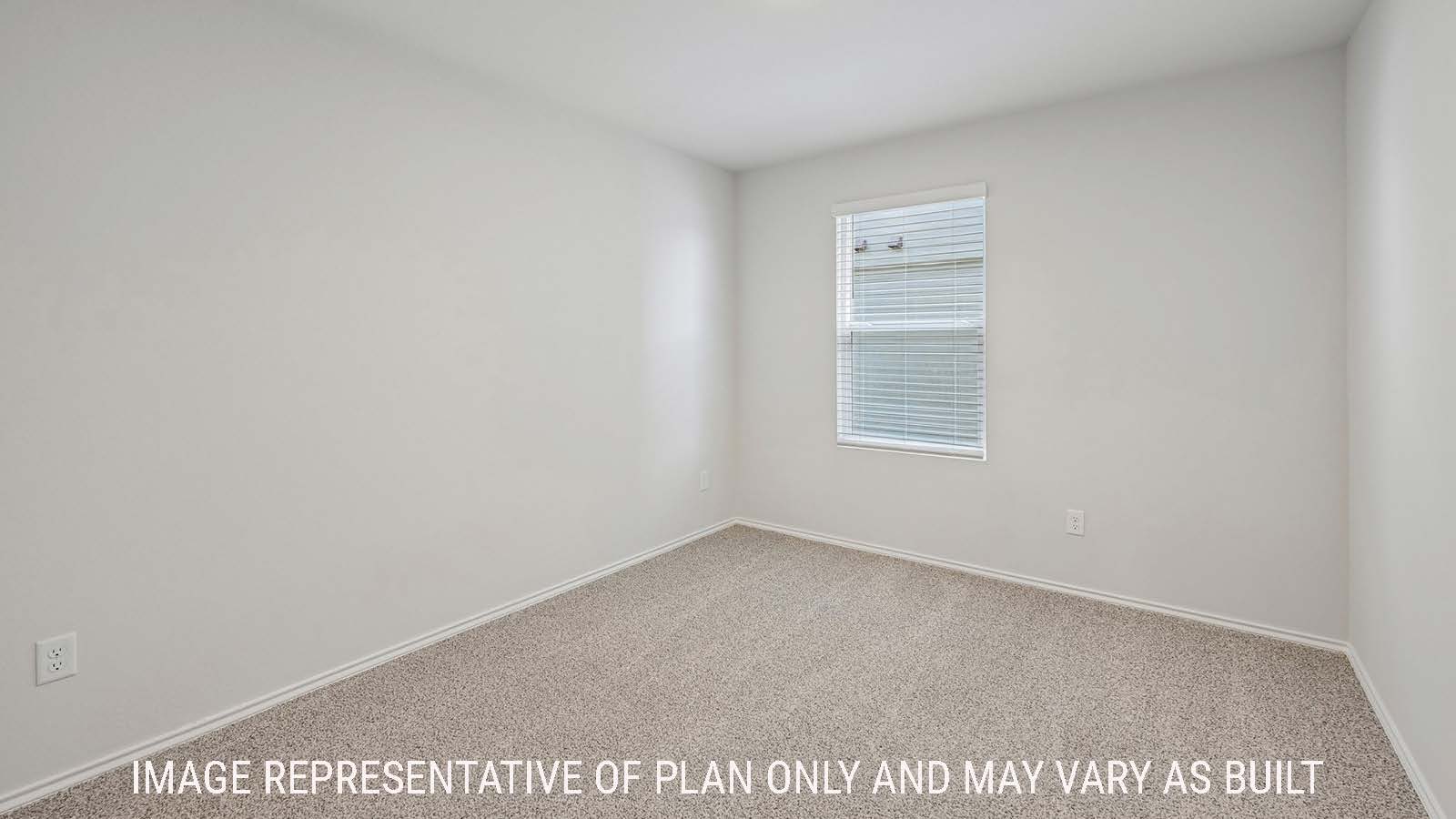 Baird secondary bedroom with carpeted flooring and window for natural lighting.