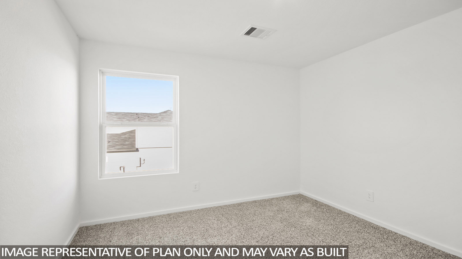 Denise secondary bedroom with carpeted flooring and window for natural lighting.