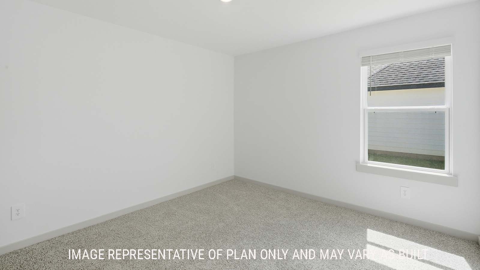 Kingston secondary bedroom with carpeted flooring and view of open concept kitchen.