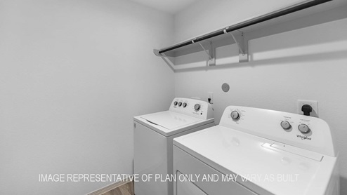 Cali utility room with washer and dryer and storage shelving.