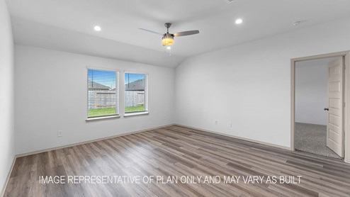 Cali living room open concept with view of backyard and primary bedroom.