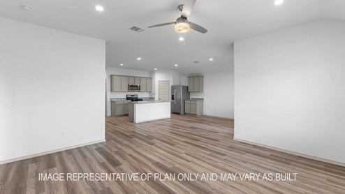 Cali living room open concept with view of dining room and kitchen.