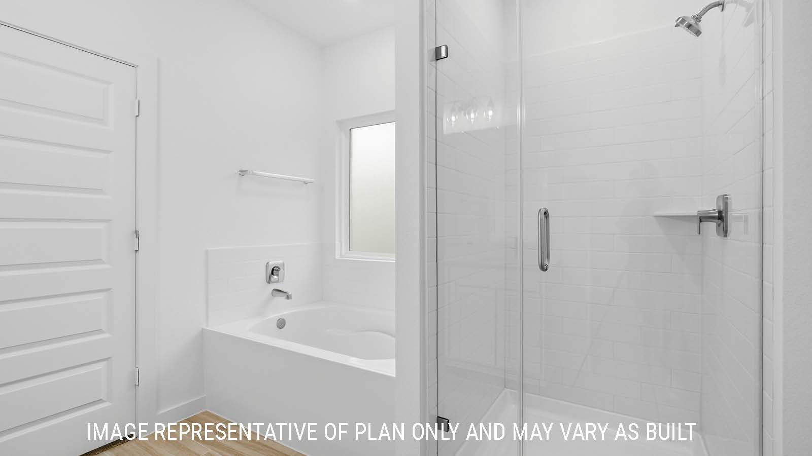 Berkshire primary bathroom with walk-in shower and garden tub.