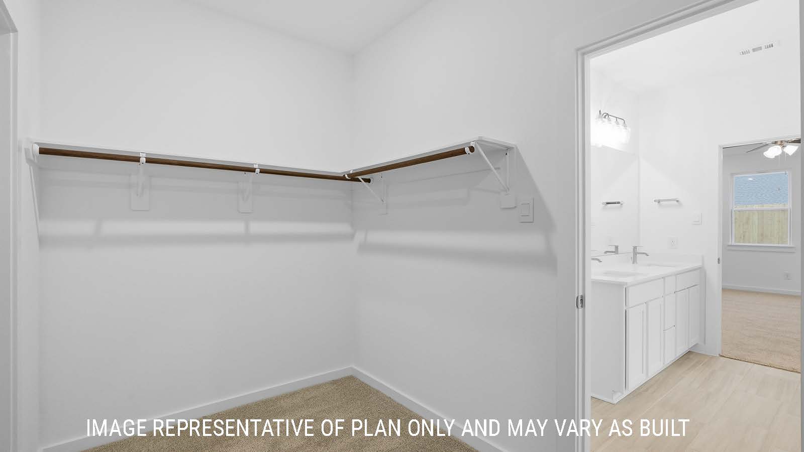 Berkshire primary bedroom closet with carpeted flooring and shelving for storage.