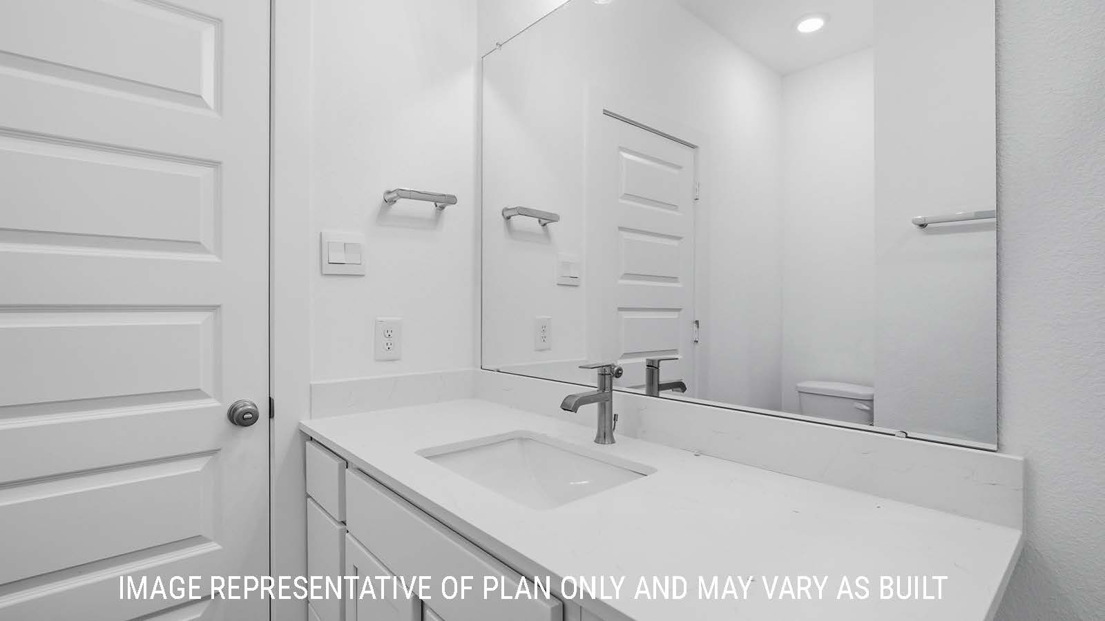 Berkshire secondary bathroom with vanity sink with white countertops and white cabinets.